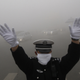 A cop braves Harbin’s October smog.